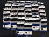 many pairs of men ' s socks with tags on them