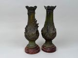 two vases that are sitting next to each other on a table