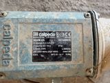 a close up of a water meter on the ground