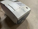 a printer that is sitting on the floor in the room