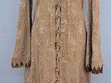 a brown dress with fringes on a mannequin mannequin