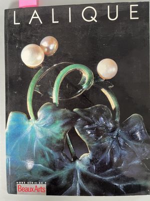 the cover of a magazine with a picture of a woman holding a flower