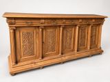 an image of a wooden chest with carvings on the front