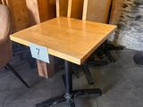 a small table and chairs in the corner of a room