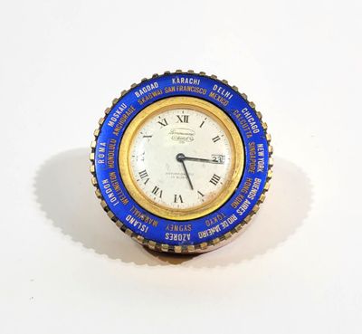 a blue and gold clock with roman numerals on it