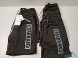 two pairs of black pants with the words charbran on them