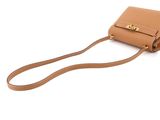 a tan leather purse with a strap and a gold clasp