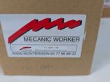a cardboard box with a sign on it that says mechanic worker