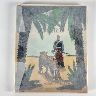 an old picture of a man with a rifle and a cheetah in front of a palm tree