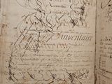 an old book with writing on it sitting on top of a table