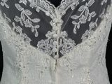 a close up of a wedding dress on a mannequin mannequin mannequin mannequin mannequin mannequin mannequin manne