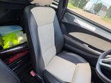 a picture of the inside of a vehicle with the driver ' s seat up