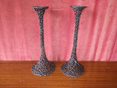 two vases that are sitting on a table