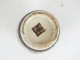 underside view of a cup with a brown and white design on it