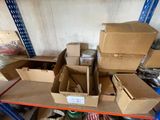 many boxes and boxes on a shelf in a room