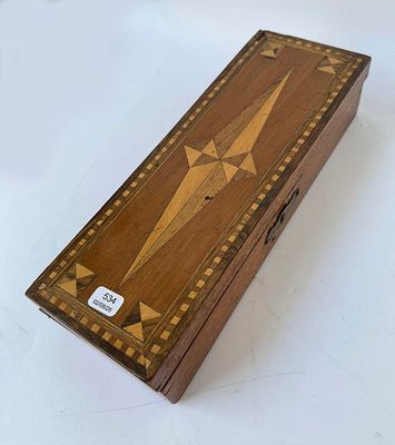 an image of a wooden box with a star design on it