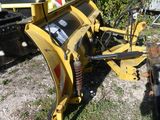a yellow machine that is sitting in the grass