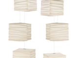 three white lamps hanging from the ceiling with a white background