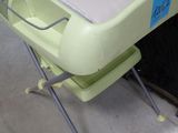 a small table with a laptop on it in a store
