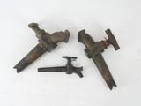 two old tools are laying next to each other on a white surface