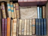a box full of old books sitting on a table