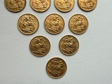 several gold coins are arranged in the shape of a triangle