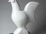 sculpture of a white chicken on a green marble base