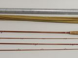 several different types of fishing rods and a fishing rod on a table