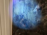 a picture of a painting on the wall of a room