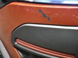 a close up of a car ' s front bumper with a logo on it