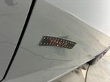 a sticker on the side of a car that says caution