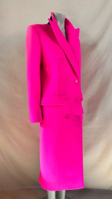 a bright pink suit on a mannequin mannequin mannequin mannequin mannequin mannequin mannequin mannequin manne