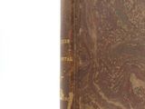an old book that is sitting on top of a table