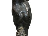 statue of a bear on a rock on a white background