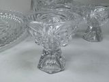 three glass bowls and a bowl on a table