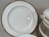 many plates stacked on top of each other on a table