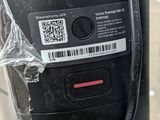 a close up of a parking meter with a sticker on it
