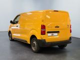 a yellow van that is parked in a room