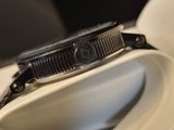 a watch that is sitting on top of a white box