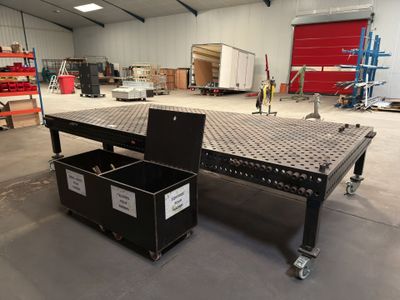 an image of a large industrial table in a warehouse