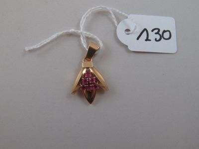 an image of a pink and gold pendant with a price tag