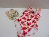 a bathing suit and a pair of sandals on a table