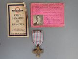 a medal and a card on a table