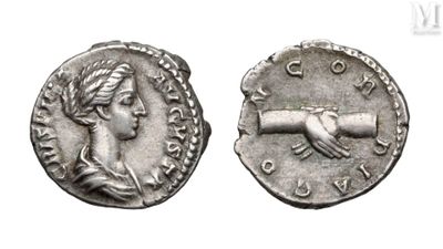 a close up of a coin with a hand on it
