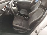 the interior of a car with a black leather seat and steering wheel