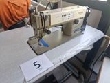 a sewing machine sitting on a table in a room