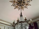 a chandelier hanging from the ceiling in a room