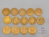 a bunch of gold coins sitting on top of a table