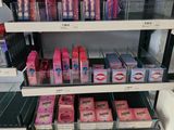 a lot of makeup products on the shelves in the store