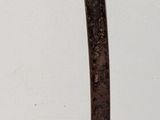 a knife that is laying on a white surface